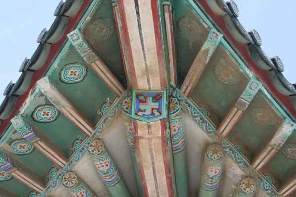The painted corner of the pavilion roof from below