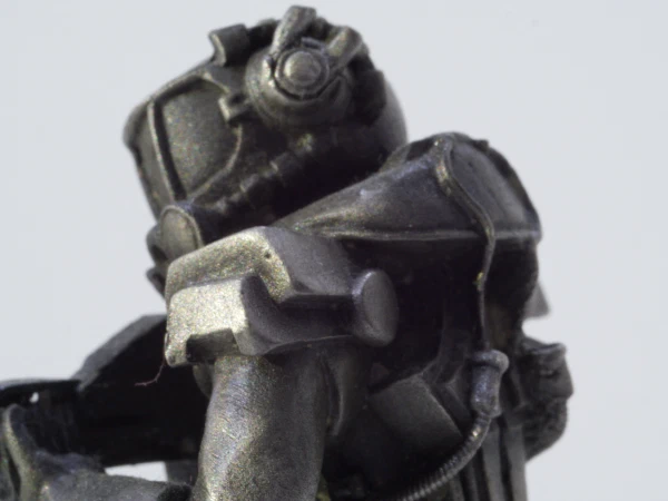 A metal figure in armor, close up