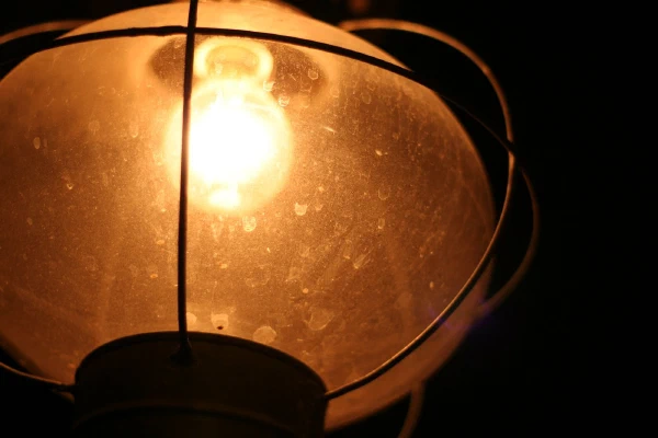 A glowing lamp in a dark room