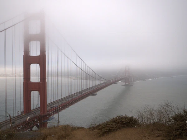 The Golden Gate Bridge disappearing into fog, 2023