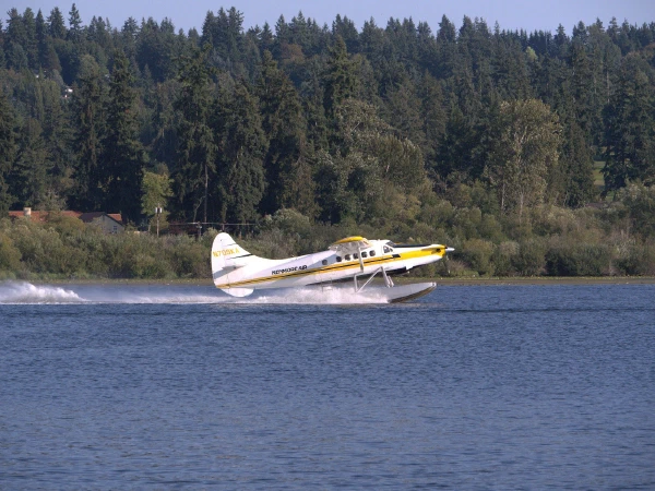 A floatplane taking off from a lake